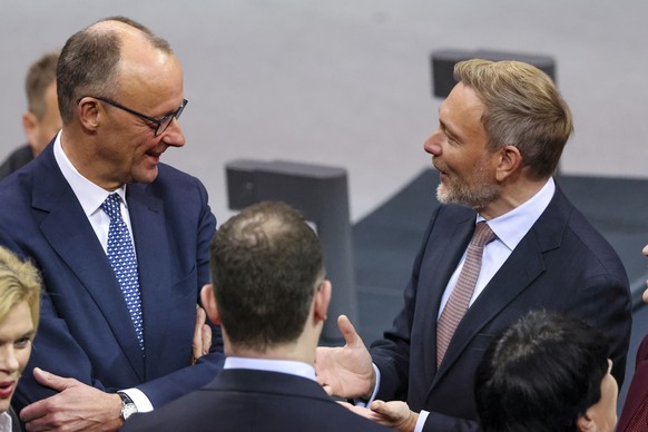 epa11780576 Chairman of Germany?s Christian Democratic Union (CDU) party Friedrich Merz (L) and Chairman of the Free Democratic Party (FDP), former German Finance Minister Christian Lindner (R) take p ...