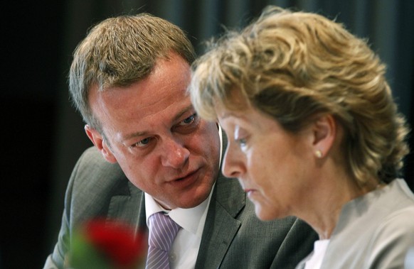 Martin Landolt (L), newly elected president of the Swiss Buergerlich Demokratische Partei party (BDP), talks to his fellow party member, Swiss President and Finance Minister Eveline Widmer-Schlumpf, d ...