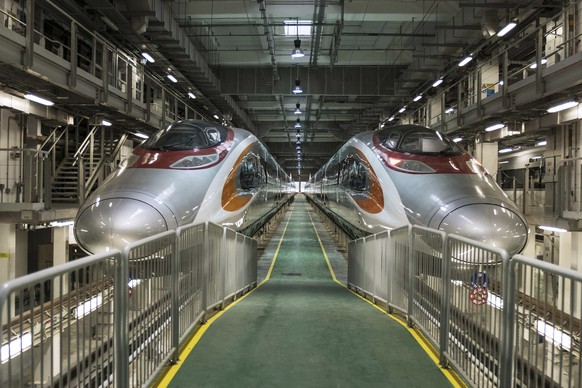 Two Guangzhou-Shenzhen-Hong Kong Express Rail Link (XRL) trains in Hong Kong, China, on Wednesday, Aug. 2, 2017. (Billy H.C. Kwok/Pool Photo via AP)