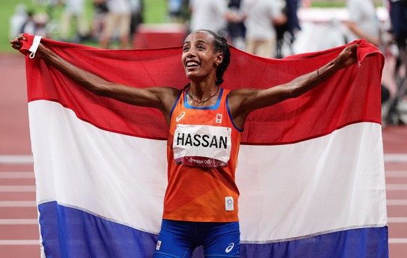 epa09403509 Sifan Hassan of the Netherlands reacts after winning the Women&#039;s 10,000m final during the Athletics events of the Tokyo 2020 Olympic Games at the Olympic Stadium in Tokyo, Japan, 07 A ...