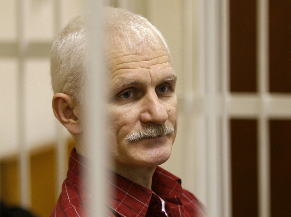 FILE - Ales Bialiatski, the head of Belarusian Vyasna rights group, stands in a defendants' cage during a court session in Minsk, Belarus, on Wednesday, Nov. 2, 2011. On Friday, Oct. 7, 2022 the  ...