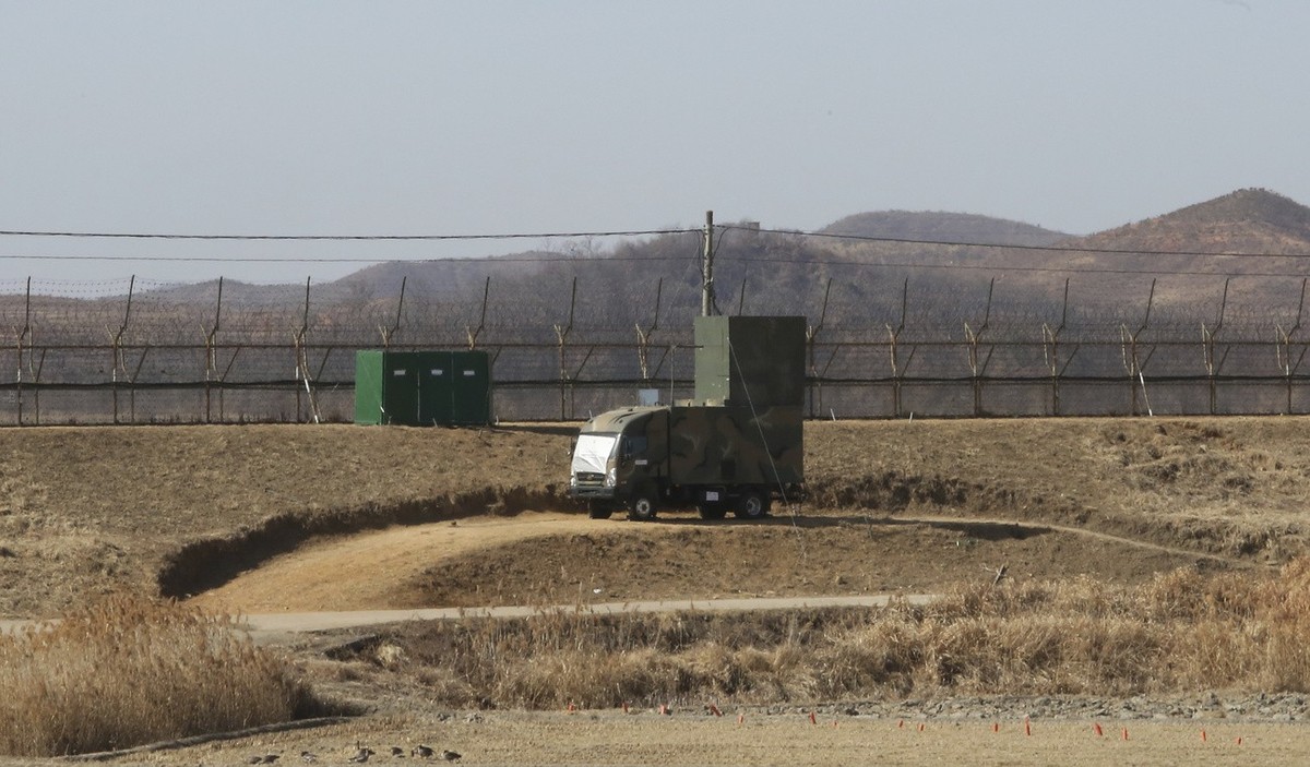 FILE - A South Korean military vehicle with loudspeakers is seen in front of the barbed-wire fence in Paju, near the border with North Korea, on Feb. 15, 2018. South Korea has recently retaliated for  ...