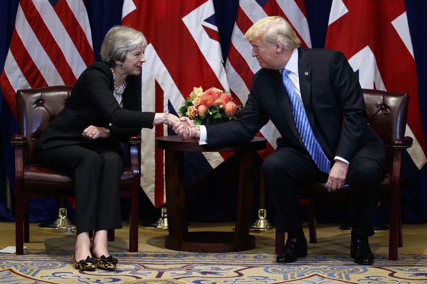 FILE - In this Sept. 26, 2018, file photo, President Donald Trump shakes hands as he meets with British Prime Minister Theresa May at the Lotte New York Palace hotel during the United Nations General  ...