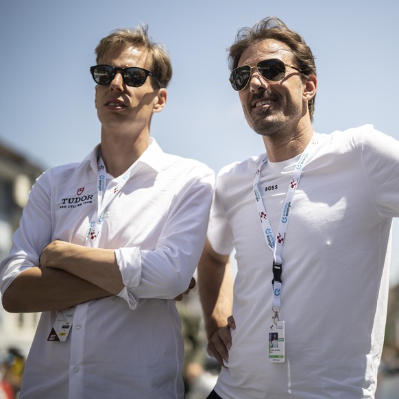 Raphael Meyer, CEO, and Fabian Cancellara, owner of Tudor Pro Cycling Team, look on prior the second stage, a 173.7 km race from Beromuenster to Nottwil, at the 86th Tour de Suisse UCI World Tour cycl ...