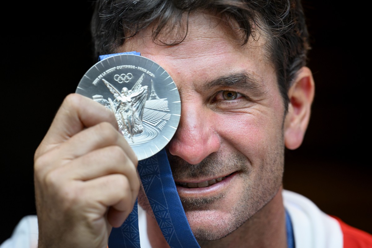 Steve Guerdat of Switzerland, winner of the silver medal of the equestrian individual finals poses with his medal at the reception in the Maison Suisse at the 2024 Paris Summer Olympics in Paris, Fran ...