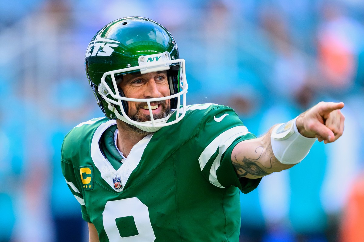 FILE - New York Jets quarterback Aaron Rodgers (8) smiles and points during an NFL football game against the Miami Dolphins, Sunday, Dec. 8, 2024, in Miami Gardens, Fla. (AP Photo/Doug Murray, File)
A ...