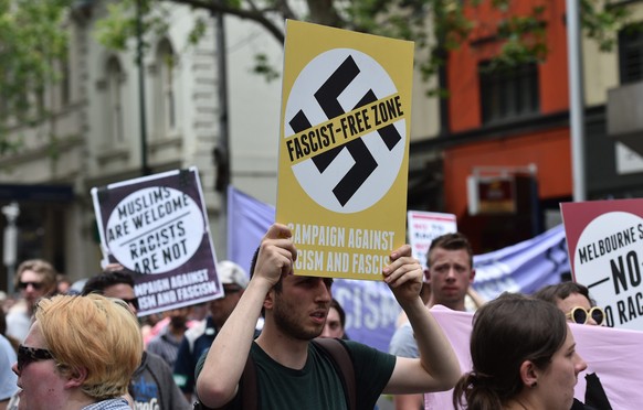 epa05639077 Campaign Against Racism and Fascism (CARF) and No Room for Racism activists demonstrate during a protest against US President-elect Donald Trump, in Melbourne, Victoria, Australia, 20 Nove ...