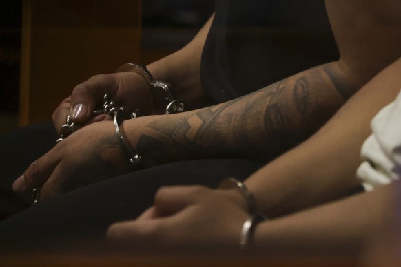 Alleged members of the Tren de Aragua sit handcuffed during a preliminary hearing where they face homicide charges, in Santiago, Chile, July 9, 2025. (AP Photo/Esteban Felix)
Chile Taking on Tren de A ...