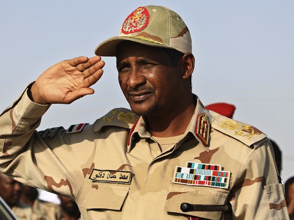 FILE - Gen. Mohammed Hamdan Dagalo, then deputy head of the military council, salutes during a rally, in Galawee, northern Sudan, June 15, 2019. Sudan has been torn by war for a year now, torn by figh ...
