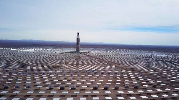 epa09256268 General view of the solar heliostats of the Cerro Dominador solar power plant, in the Antofagasta region, north of Santiago, Chile, 08 June 2021. About 10,600 heliostats (mirrors), 392,000 ...