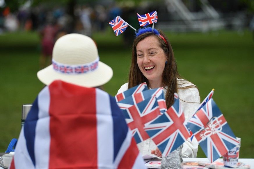 epa09997421 People in Union Jack costume take part in The Big Lunch on the Long Walk, during the celebrations of the Platinum Jubilee of Queen Elizabeth II, near Windsor Castle Britain, 05 June 2022.  ...