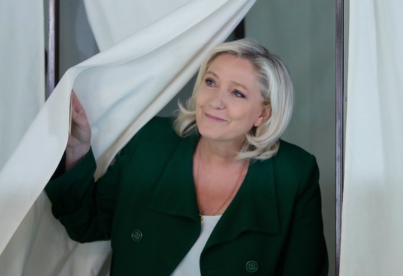 epaselect epa10009195 French far right candidate Marine Le Pen of the RN, Rassemblement National party (National Rally in French) leaves the voting booth before casting her ballot in the first round o ...