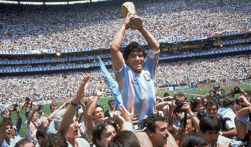FILE - This is a June 29, 1986 file photo of Diego Maradona of Argentina celebrates with the cup at the end of the World Cup soccer final in the Atzeca Stadium, in Mexico City, Mexico. Argentina defea ...