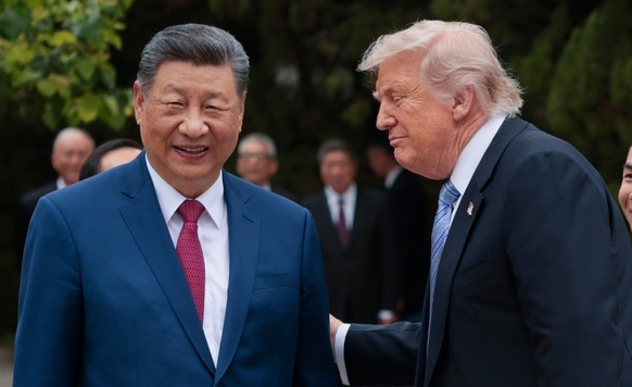 U.S. President Donald Trump, right, speaks with Chinese President Xi Jinping while leaving after a visit to the Zhongnanhai Garden in Beijing, Friday, May 15, 2026. (Evan Vucci/Pool Photo via AP)
Chin ...