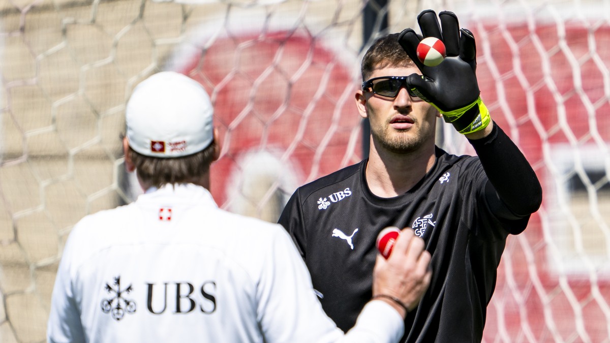 Switzerland goalkeeper Gregor Kobel plays the ball during a training session of the Swiss national soccer team at the University of Utah soccer Field, in Salt Lake City, Utah, United States of America ...