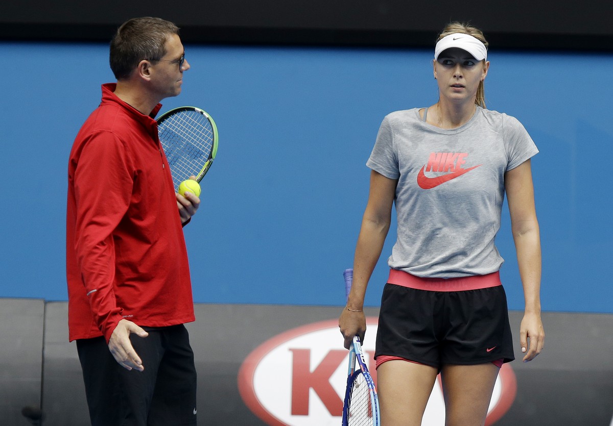 Russia's Maria Sharapova talks with her coach Sven Groeneveld, left, return during a practice session on Rod Laver Arena at the Australian Open tennis championship in Melbourne, Australia, Thursd ...