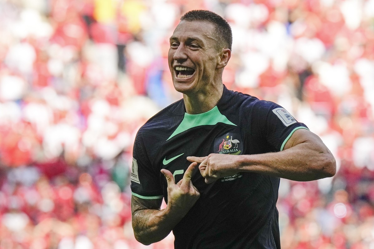 Australia's Mitchell Duke celebrates after he scored the opening goal during the World Cup group D soccer match between Tunisia and Australia at the Al Janoub Stadium in Al Wakrah, Qatar, Saturda ...