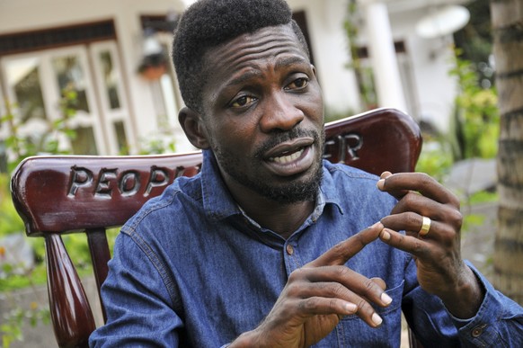 FILE - In this Friday, March 27, 2020 file photo, Ugandan musician, lawmaker and presidential aspirant Bobi Wine, whose real name is Kyagulanyi Ssentamu, speaks to The Associated Press in Kampala, Uga ...