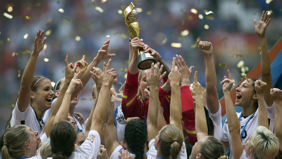 The United States Women's National Team celebrates with the trophy after they defeated Japan 5-2 in the FIFA Women's World Cup soccer championship in Vancouver, British Columbia, Canada, Sun ...