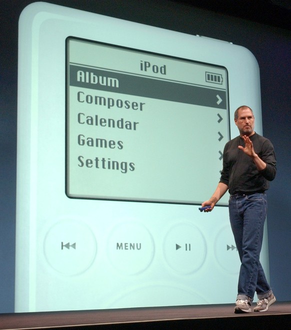 FILE - In this April 28, 2003 file photo, Apple Computer Inc. chief executive Steve Jobs gestures as he introduces the new iPod during Apple&#039;s launch of their new online &quot;Music Store&quot; i ...