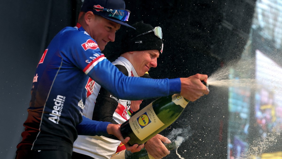 epa10555748 Winner Slovenia's Tadej Pogacar (2-nd L), of UAE Team Emirates and 2-nd placed Netherlands' Mathieu Van Der Poel, of Alpecin-Deceunink team (L) celebrate during the podium ceremo ...