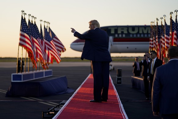 Former President Donald Trump points to the crowd as he leaves after speaking at a campaign rally at Waco Regional Airport, Saturday, March 25, 2023, in Waco, Texas.  (AP Photo/Evan Vucci) Donald Trump