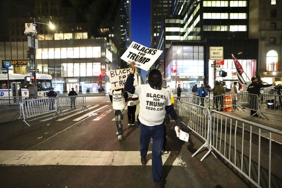 Supporters of former President Donald Trump demonstrate at Trump Tower, Tuesday, April 4, 2023 in New York.  Trump is expected to travel to New York to face charges related to hush money payments.  Tra...