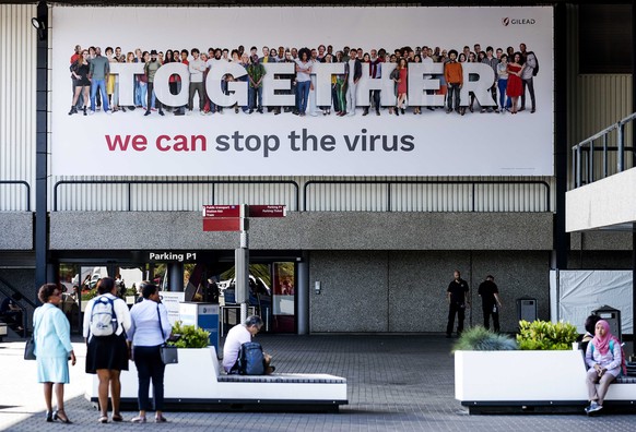 epa06905976 A banner with the slogan &#039;Together we can stop the virus&#039; welcomes the participants of the 22nd International AIDS Conference 2018 at the RAI Convention Center in Amsterdam, The  ...
