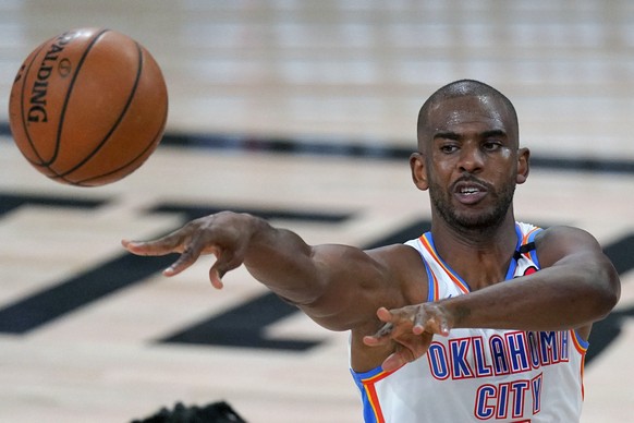 FILE - Oklahoma City Thunder&#039;s Chris Paul (3) makes a pass during the first half of an NBA first-round playoff basketball game against the Houston Rockets in Lake Buena Vista, Fla., in this Wedne ...