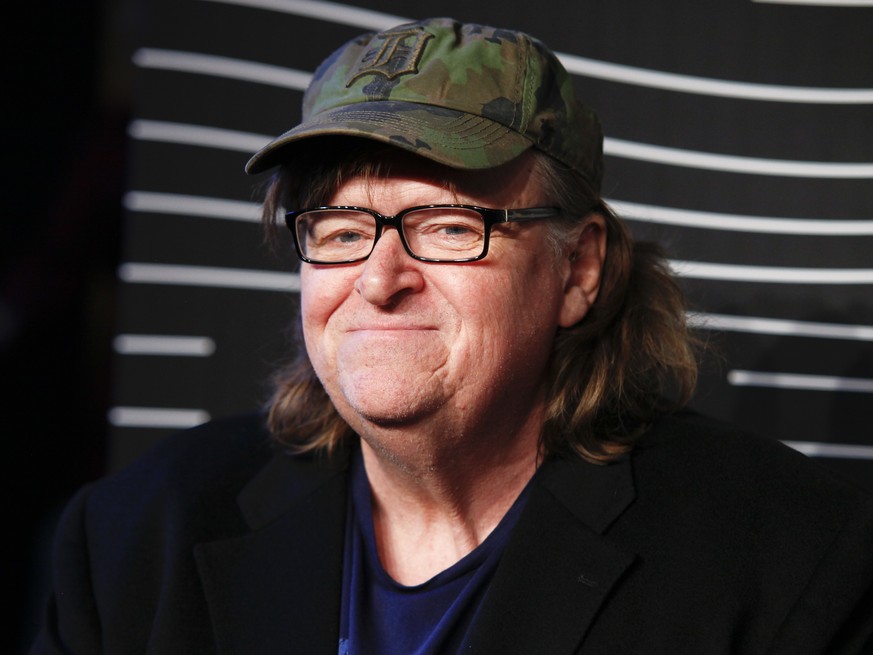 FILE - In this May 16, 2016 file photo, Michael Moore attends the 20th Annual Webby Awards at Cipriani Wall Street in New York. Moore premiered a surprise film about the U.S. presidential election on  ...