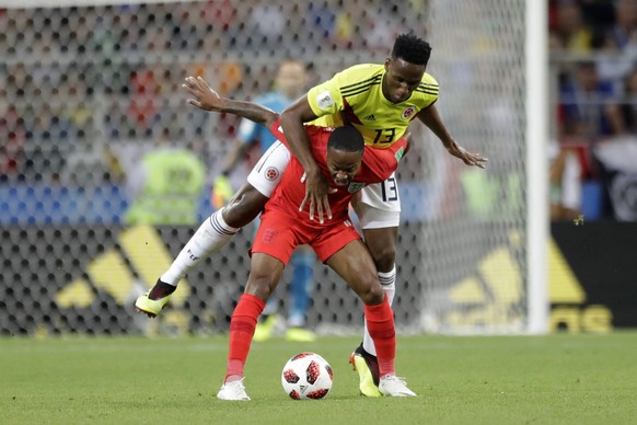 England&#039;s Raheem Sterling, foreground, and Colombia&#039;s Yerry Mina fight for the ball during the round of 16 match between Colombia and England at the 2018 soccer World Cup in the Spartak Stad ...