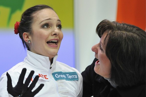 Sarah Meier from Switzerland, left, reacts next to her coach Evi Fehr upon realizing her victory in the ladies free skating at the ISU European Figure Skating Championships in the Postfinance Arena in ...