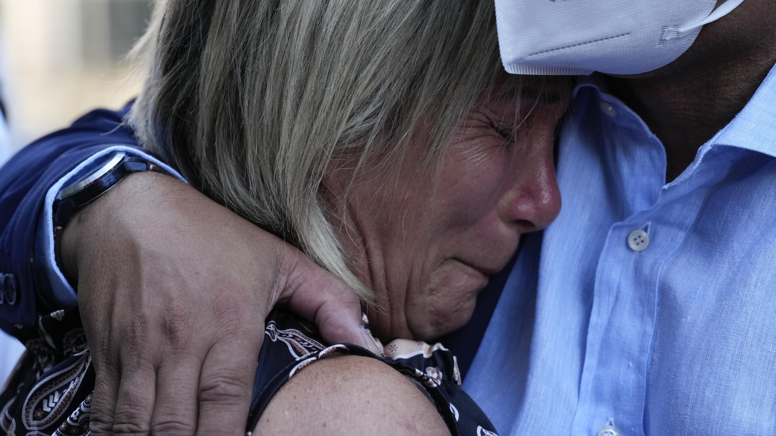 Paola Vicini, mother of Mirko, one of the 43 victims, is hugged by a relative outside the Genoa&#039;s Palace of Justice on opening of the first hearing of the trial for the Morandi bridge collapse, T ...