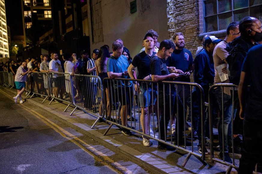 LONDON, ENGLAND - JULY 19: People queue to get in to the Egg London nightclub in the early hours of July 19, 2021 in London, England. As of 12:01 on Monday, July 19, England will drop most of its rema ...