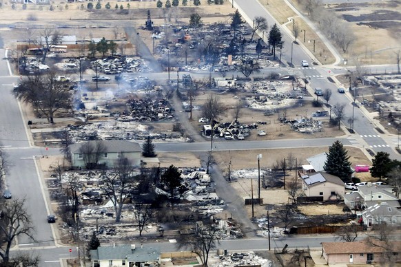 Burned homes in a Boulder County neighborhood destroyed by wildfires are seen from a Colorado National Guard helicopter on Friday, Dec. 31, 2021. Tens of thousands of Coloradans driven from their neig ...