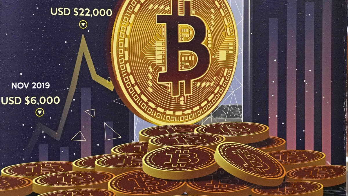FILE - An advertisement for Bitcoin cryptocurrency is displayed on a street in Hong Kong, on Feb. 17, 2022. Bitcoin briefly hit an all-time high Tuesday, March 5, 2024, with the world's largest c ...