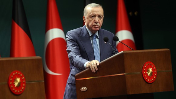 epa12493389 Turkish President Recep Tayyip Erdogan looks on during a joint press conference with German Chancellor Friedrich Merz (not pictured) at the Presidential Palace in Ankara, Turkey, 30 Octobe ...