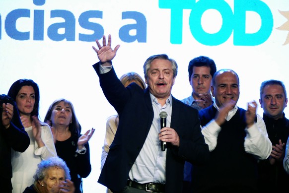 epa07769184 Alberto Fernandez (C) speaks to Frente de Todos party supporters during a post-election event in Buenos Aires, Argentina, 11 August 2019. Fernandez has claimed victory in the primaries ele ...