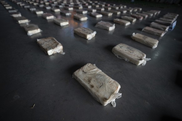 Confiscated cocaine is shown to the press at a police hangar in Buenos Aires, Argentina, Thursday, Oct. 6, 2022. Police say they arrested three men from Peru and three from Paraguay with almost half a ...