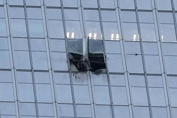 The surface of the Citic Tower also known as Zun Tower is damaged in Beijing, Cina, Friday, June 26, 2026. (AP Photo/Han Guan Ng) Correction: source of the damage removed as it is unknown and name of  ...