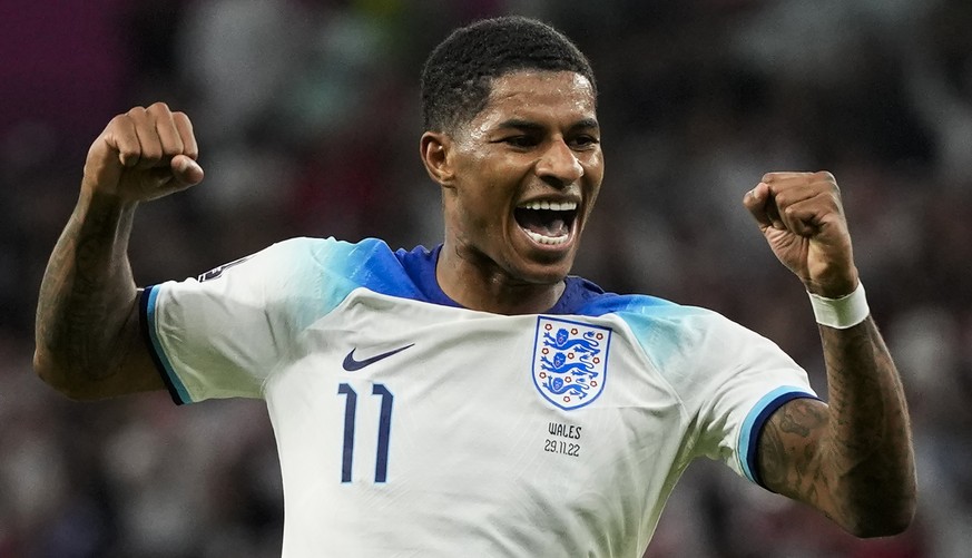 England&#039;s Marcus Rashford celebrates after scoring his side&#039;s third goal during the World Cup group B soccer match between England and Wales, at the Ahmad Bin Ali Stadium in Al Rayyan , Qata ...