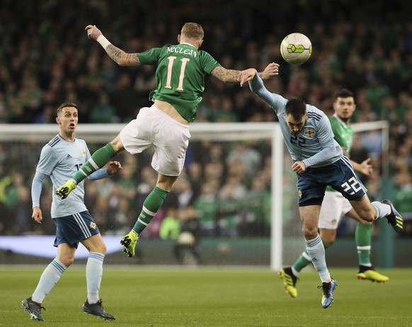 Northern Ireland's Michael Smith, right, and Republic of Ireland's James McClean in action during their International Friendly at The Aviva Stadium in Dublin, Thursday, Nov. 15, 2018. (Brian Lawless/P ...