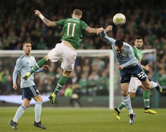 Northern Ireland&#039;s Michael Smith, right, and Republic of Ireland&#039;s James McClean in action during their International Friendly at The Aviva Stadium in Dublin, Thursday, Nov. 15, 2018. (Brian ...