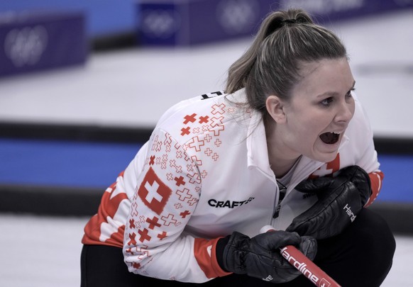 Switzerland&#039;s Jenny Perret reacts during the mixed doubles curling match against Italy at the 2022 Winter Olympics, Thursday, Feb. 3, 2022, in Beijing. (AP Photo/Nariman El-Mofty)