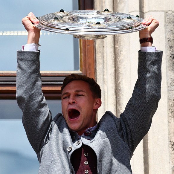epa12113195 Goalkeeper Manuel Neuer of Munich (L) and Joshua Kimmich of Munich (R) celebrate on the balcony of the City Hall at Marienplatz Square in front of supporters in Munich, Germany, 18 May 202 ...