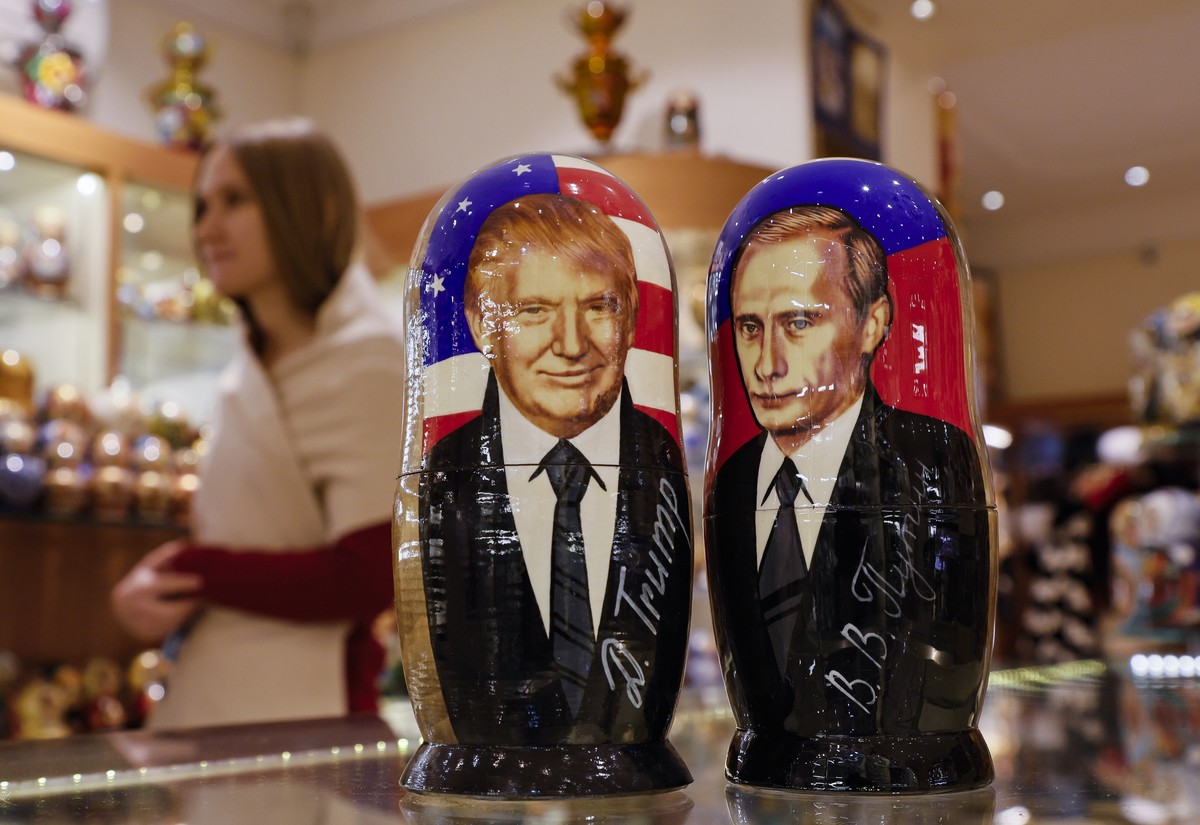 epa11704990 Traditional Russian Matryoshka wooden dolls, also known as nesting dolls, depicting US Republican presidential candidate Donald J. Trump (L) and Russian President Vladimir Putin (R), are o ...