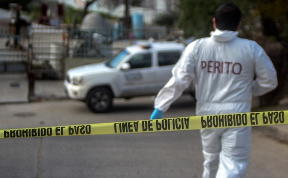 epa09692003 A forensic expert checks the house of slain photojournalist Margarito Martinez, in Camino Verde, Tijuana, state of Baja California, Mexico, 17 January 2022. The Mexican photojournalist who ...