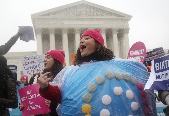 FILE - Margot Riphagen of New Orleans, wears a birth control pill costume as she protests in front of the Supreme Court in Washington on March 25, 2014. In 2022, a leaked draft opinion indicating U.S. ...