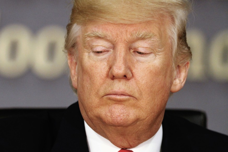 President Donald Trump pauses during a meeting with emergency officials to discuss the hurricane season, Friday, Aug. 4, 2017, at Federal Emergency Management Agency (FEMA) headquarters in Washington. ...