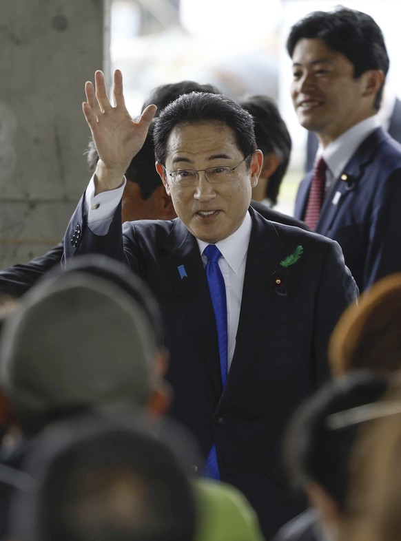 Japanese Prime Minister Fumio Kishida waves as he visits a port in Wakayama, western Japan to cheer his ruling party&#039;s candidate in a local election, Saturday, April 15, 2023. Japan?s NHK televis ...